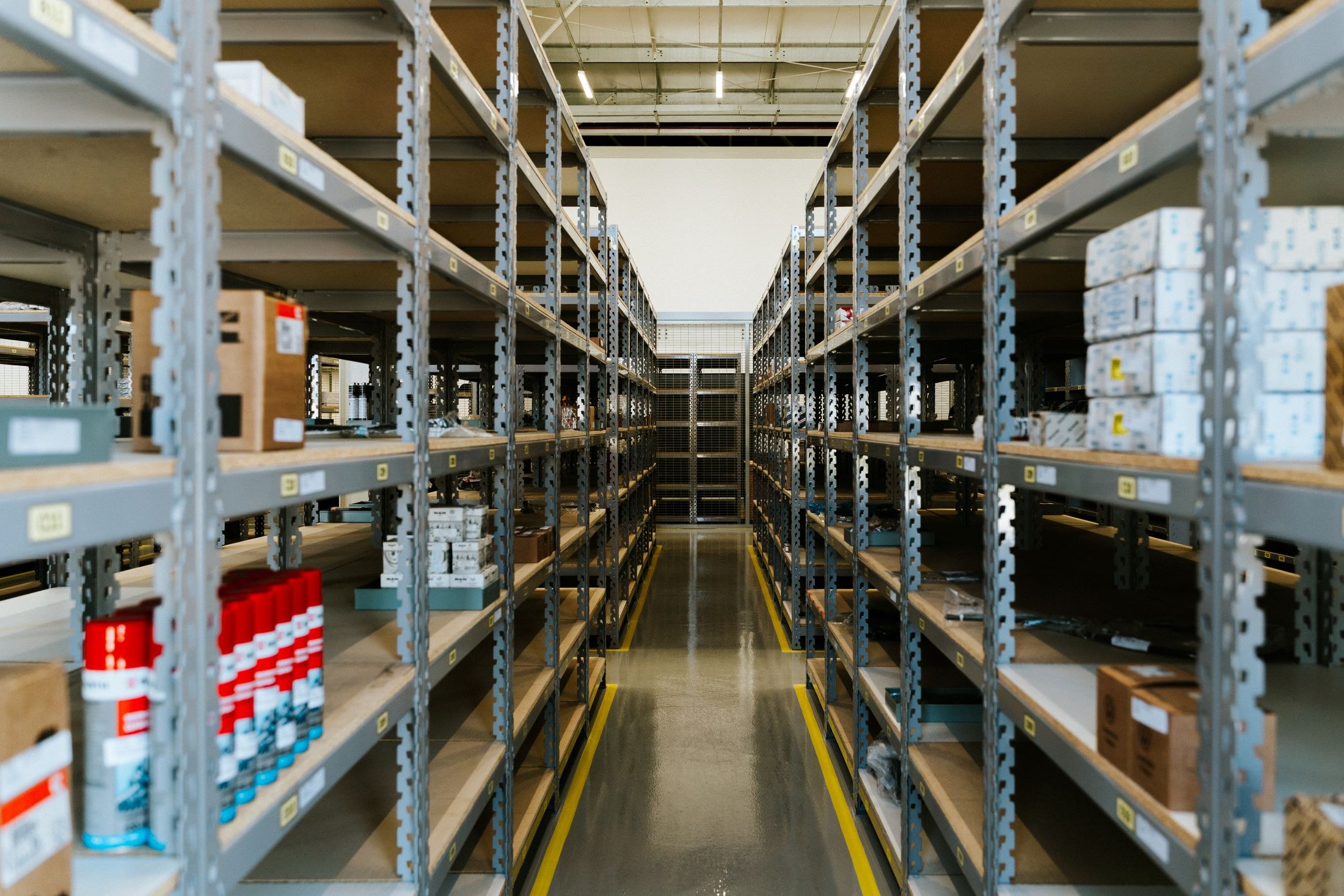 Industrial warehouse racks and shelves holding boxed inventory